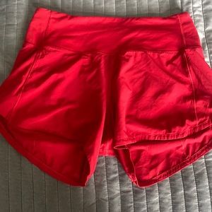 Red Lululemon “speed up” shorts
